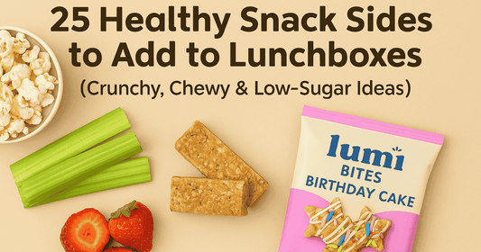 Healthy lunchbox snack sides including popcorn, celery sticks, strawberries, granola bars, and a Lumi Bites Birthday Cake snack bag on a beige background.
