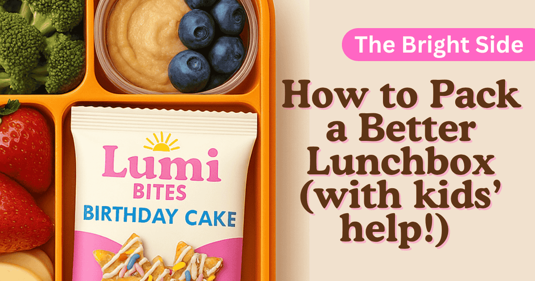 Colorful lunchbox packed with fresh fruit, veggies, hummus, and a Lumi Bites Birthday Cake snack pouch, illustrating a fun and healthy way to pack a better lunchbox with kids’ help