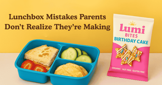 School lunchbox with sandwich, strawberries, cucumber slices, and a Lumi Bites Birthday Cake snack bag under the headline Lunchbox Mistakes Parents Don’t Realize They’re Making.